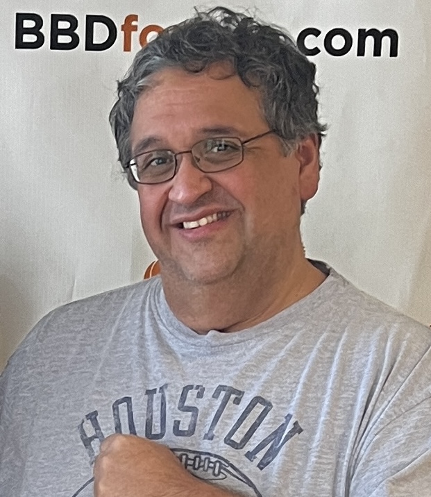Happy man wearing a gray Houston t-shirt